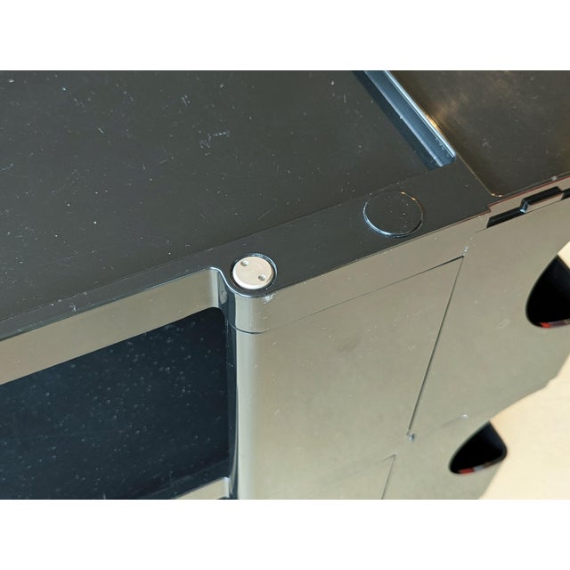 Low version of the Boby container designed by Joe Colombo in the 1960s. This is a black plastic container unit with 3...