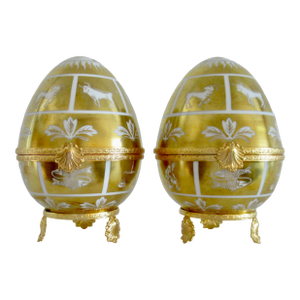 Limoges for Tiffany & Co., 22Kt. Gilded, With Gold Hand-Painted in France "Zodiac," Porcelain Egg Boxes, Decorative Accents - A Pair