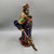 This striking standing statue depicts Guan Gong, the revered Chinese warrior deity, holding his signature guan dao blade....