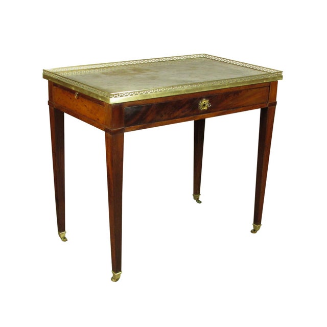 An 18th-C. Louis XVI mahogany serving table with carrara marble top framed with a brass gallery, pullout candle rests...