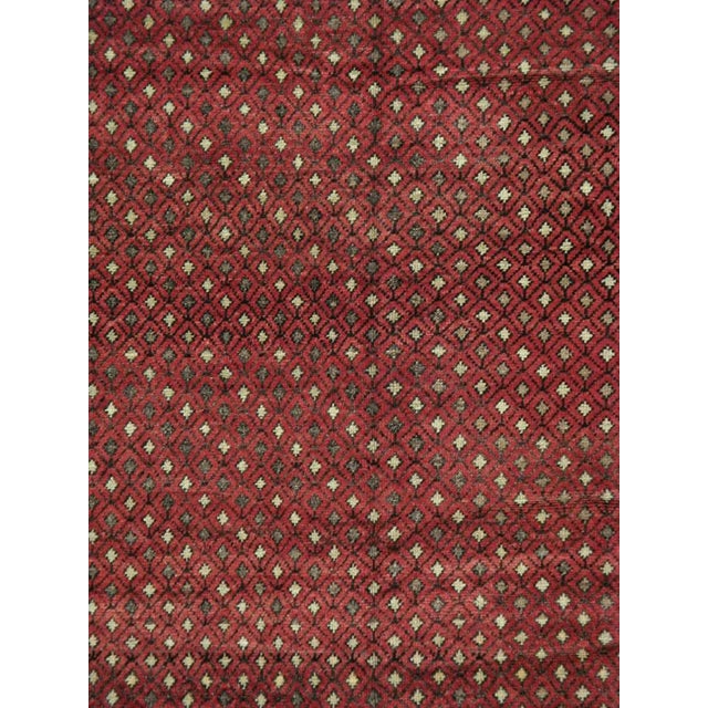 This mid-20th-century Turkish Anatolian small gallery carpet presents a dense allover lattice of small diamonds across a...