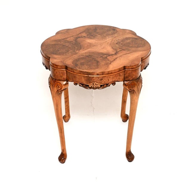 A beautiful and elegant antique burr walnut occasional side table. This was made in England, it dates from around the...