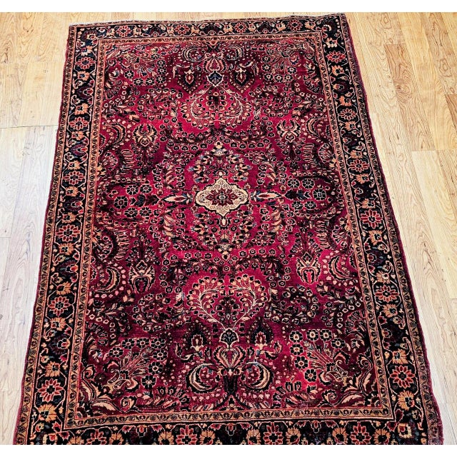 "An exceptional antique Persian Sarouk carpet dating to the first quarter of the 20th century, handwoven in the...