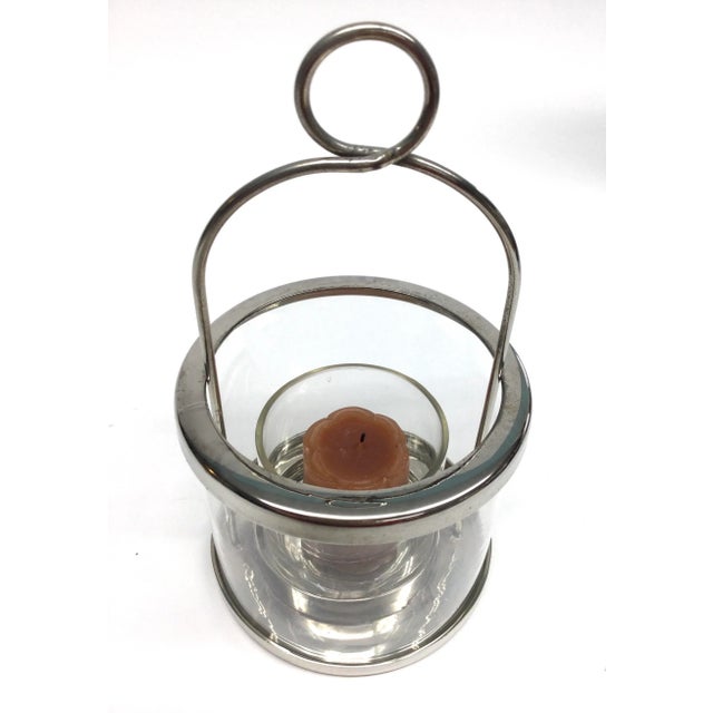 Lovely vintage Silverplate and glass candle holder. We love these. Sit them on a table or hang from the ceiling or a...