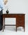 This writing desk carries genuine presence, its dark mahogany, leather top, drawers immediately setting the tone for the...