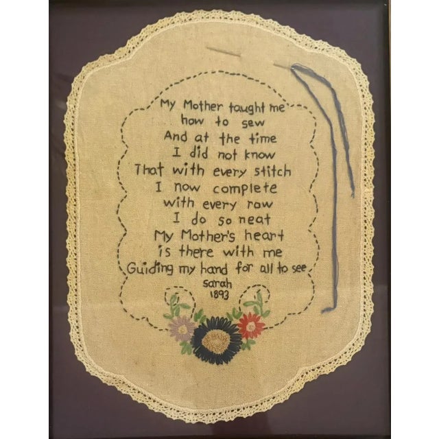 This embroidered sampler features a heartfelt verse about a mother teaching her daughter to sew. Signed by Sarah with the...