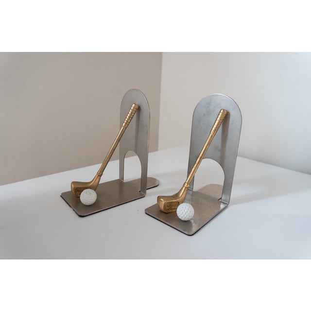Pair of vintage brass & chrome golf themed bookends. Chrome finish on the body with great patina and features brass golf...