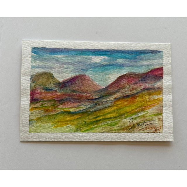 Red hills in the desert under blue skies. Signed and ready to frame.