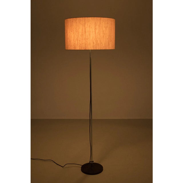 Vintage floor lamp by Staff Leuchten from Germany. The lamp is made of chrome with a beige lampshade and black base. Has...