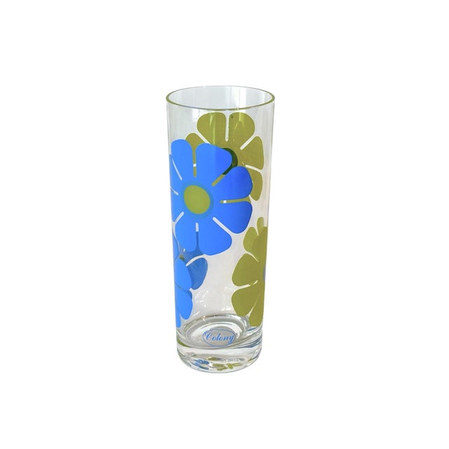 A set of six midcentury modern highball glasses by Colony, an Indiana Glass brand. Decorated with a bold daisy motif in...