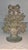 An ornate antique solid cast brass doorstop in the form of a lush floral basket or urn. The openwork design features a...