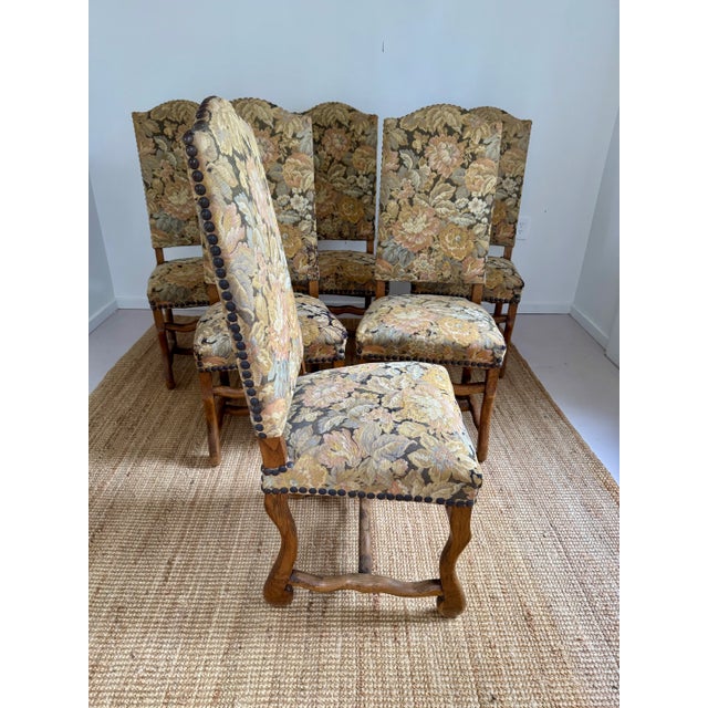 A beautifully upholstered and generously sized set of French dining chairs, featuring Chateau de Gendarme backs and...