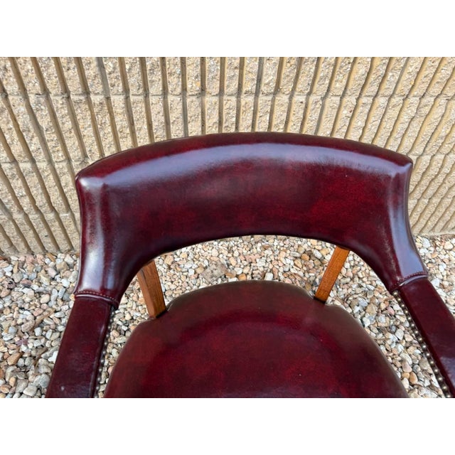 Hickory Leather Company Set of Four Vintage Burgundy/ Oxblood Vinyl Brass Nailed Armchairs. Solid wood Frame with fine...