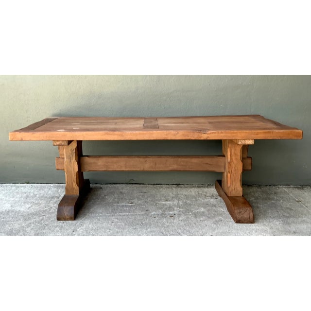 Constructed with heavy solid oak planks, this early 20th-century farmhouse dining table embodies traditional European...