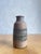 This handcrafted stoneware vase by Swedish ceramic artist Tomas Anagrius exemplifies the refined balance between...