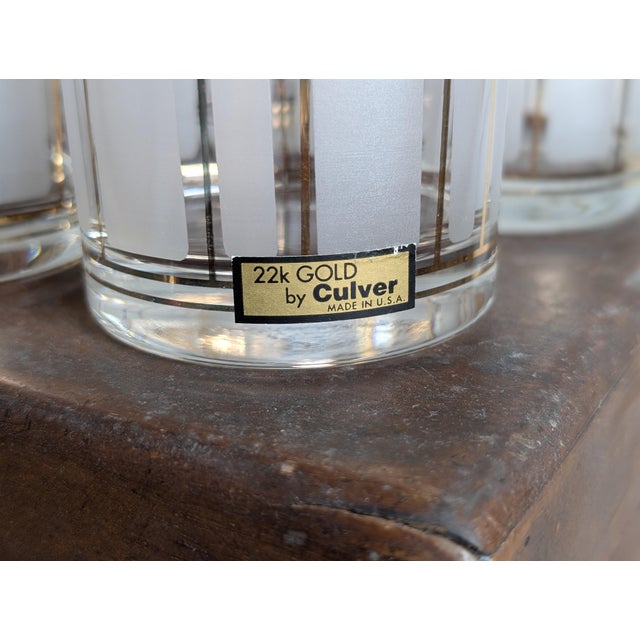 On offer: a set of six Culver Ltd ServeMates double rocks glasses, with 22k gold trim and vertical frosted white stripes....