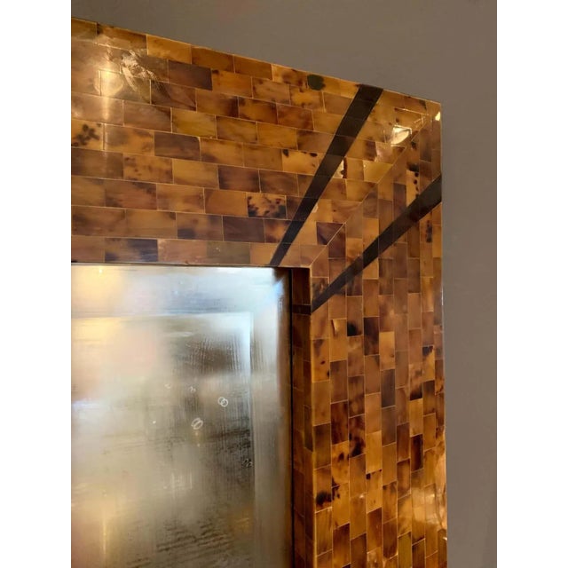 This rare and signed large Karl Springer mirror in tessellated horn with deco style accents. It is very heavy and beveled...