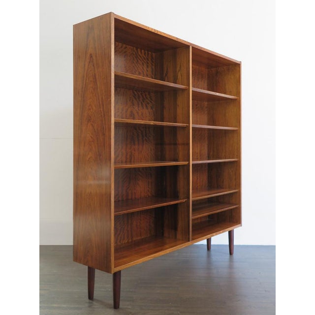 Scandinavian library in dark wood, designed by Poul Hundavad for Hundavad & Co with height adjustable shelves. Denmark,...