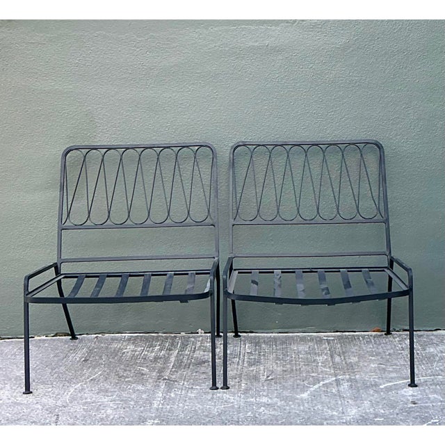 Elevate your outdoor sanctuary or sunroom with this iconic pair of Mid-Century Modern lounge chairs, attributed to the...