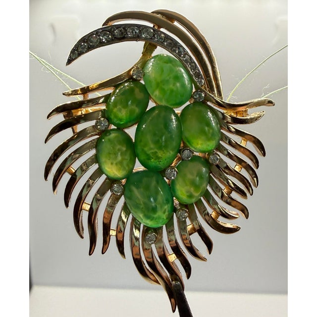 Crown Trifari faux jade and rhinestone brooch with original hang tags. Has both Trifari and department store Printemps...