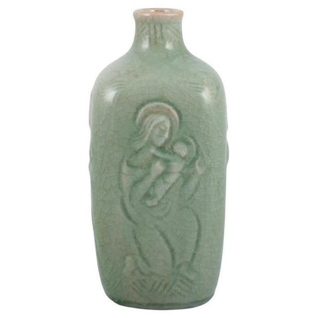 Jais Nielsen for Royal Copenhagen. Ceramic vase in celadon glaze with religious motifs. Model: 3543. 1940s. In excellent...