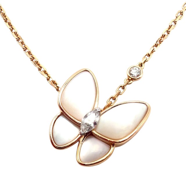 The Van Cleef & Arpels Two Butterfly Pendant Necklace with 18k rose gold, diamonds, and mother-of-pearl wings. Van Cleef &...