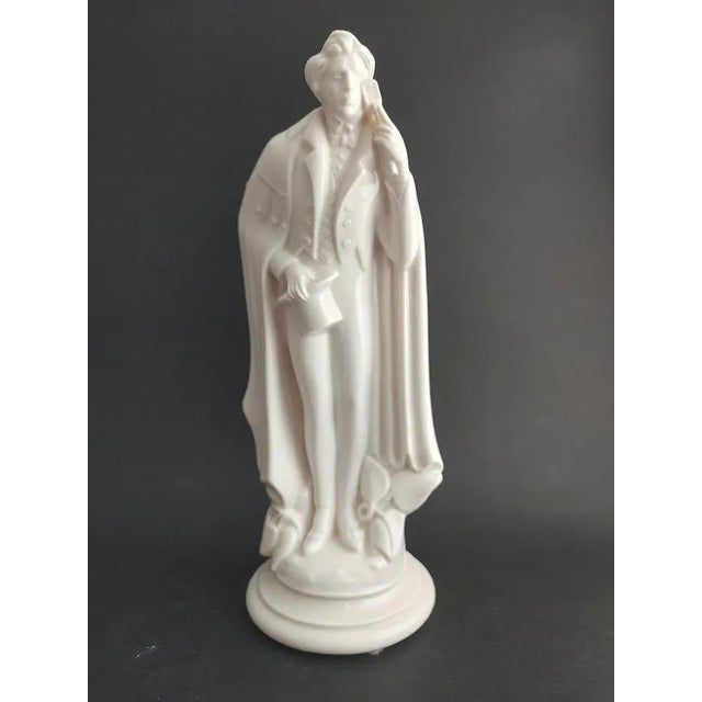 Amazing detail and beautifully created porcelain figure of a man bowing with his courtship card in hand. Crafted in the...