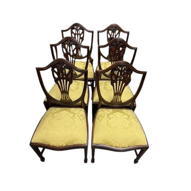Beautiful set of 6 mahogany dining chairs. These are bench made in England, they are in the Hepplewhite style. They have...
