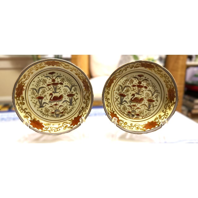 Pair of beautifully hand‑painted Andrea by Sadek bowls featuring an elegant red swan surrounded by ornate florals and...