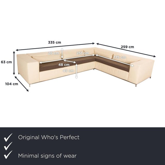 The Boston sofa from Who's Perfect is upholstered in cream-colored genuine leather and stands on small metal legs. This...