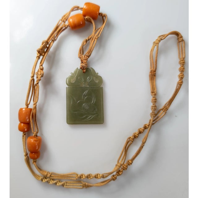 We are selling this Chinese carved Green Nephrite Jade plaque. This plaque is engraved with simple floral designs and...