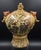 An opulent statement piece of Japanese decorative art, this 14-inch Satsuma-style porcelain urn is a masterclass in the...