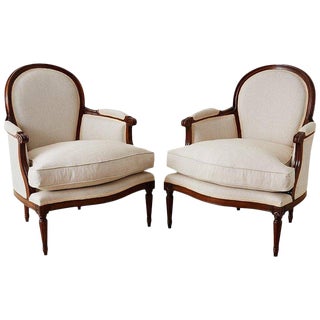 Pair of French Louis XVI Style Walnut Bergeres For Sale