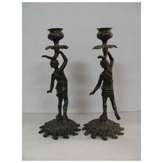Pair of Small Art Nouveau Candlestick with bronze finish. Have a young woman on each. Height: 9" Base: 3.5"