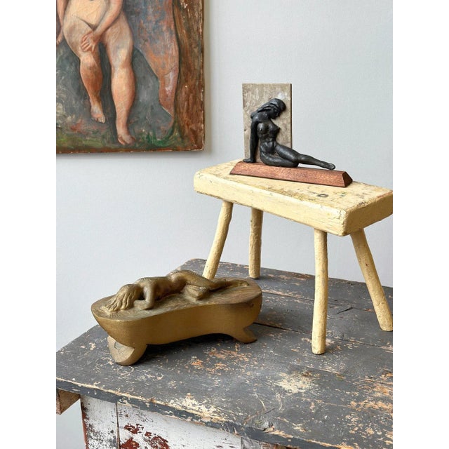 Vintage Gold-Painted Carved Wood Nude in Repose, Circa 1950s. Carved from a single piece of wood in the round, this nude...