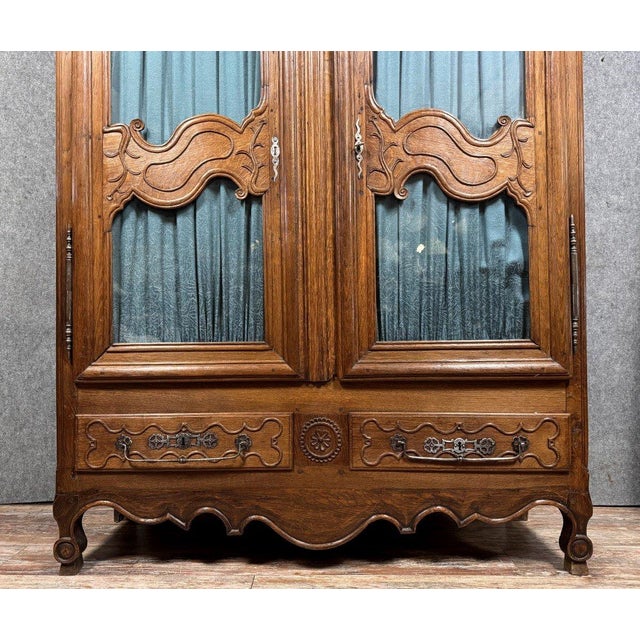 Louis nice sculpture decorations shelving and curtains the whole rests on arched rolling feet housed under a serrated...