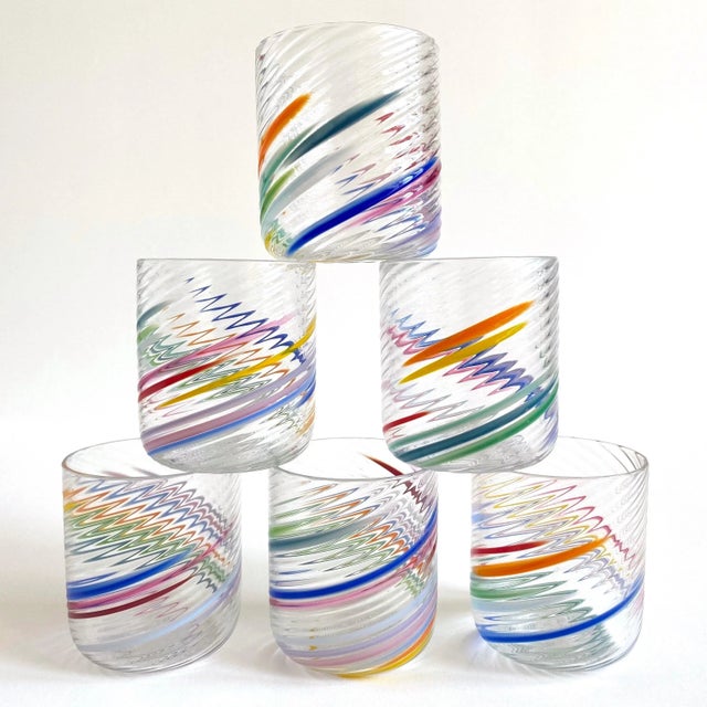 This set of six rare vintage 1980's Post Modern hand blown studio art glass multicolor Abstract swirl drinking glasses is...