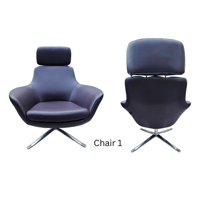 Elevated pair of Coalesse by Steelcase leather swivel lounge chairs, Model 223. Designed with a sculptural silhouette,...