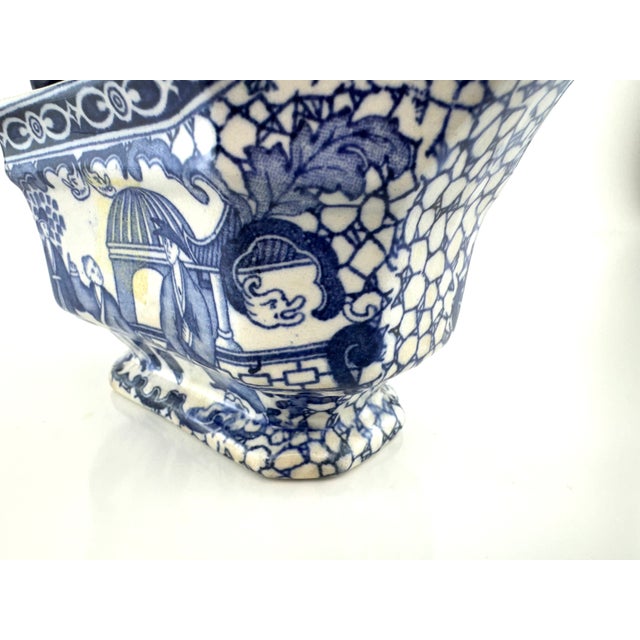 This exquisite antique gravy boat from the esteemed Adams family pottery captures the elegance of 19th-century English...