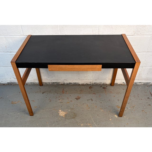 Walnut and Leather "Risom" Desk By Design Within Reach. A refined mid-century modern desk featuring a sleek black leather...