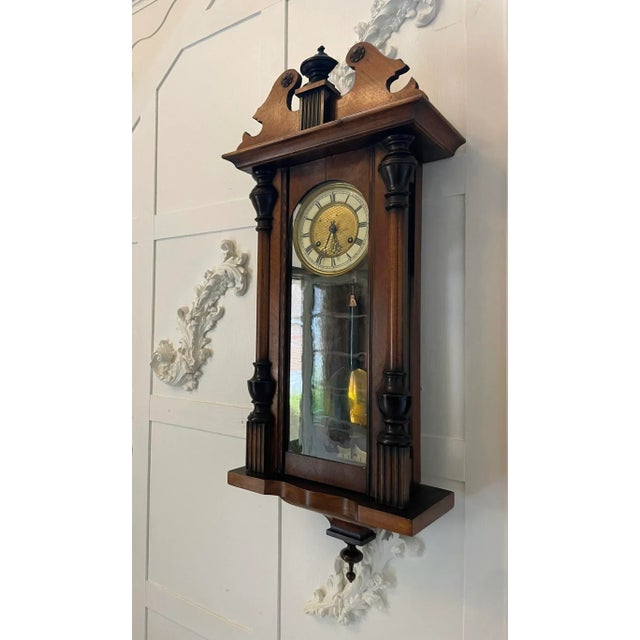 Antique Victorian walnut Vienna wall clock having a shaped swan neck top and a superb quality walnut case with turned...