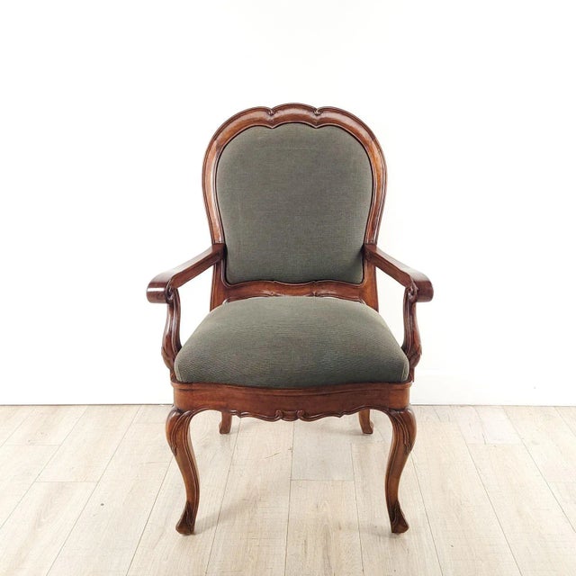 A bespoke bench-made Baroque-style walnut armchair, circa 1990. Seat height 22.75".