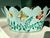 A charming vintage toleware cachepot with a rare teal‑turquoise painted ground and hand‑painted butterfly and vine motifs....