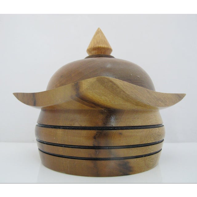 Vintage hand turned mid century style wooden vessel with lid. Rounded body with distinct horizontal burned accent lines....