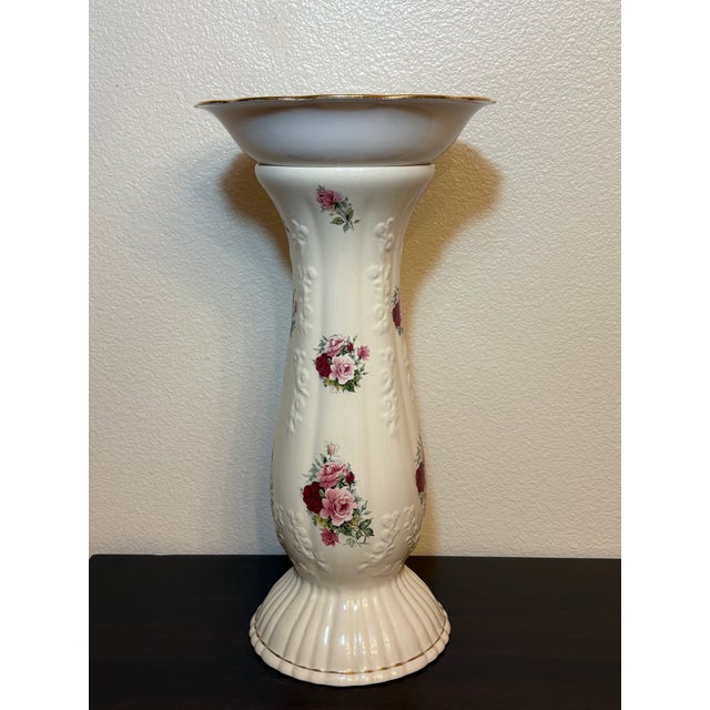 This whimsical white porcelain birdbath with rose motif on it is quite lovely standing at 19 inches tall and is 9 and a...