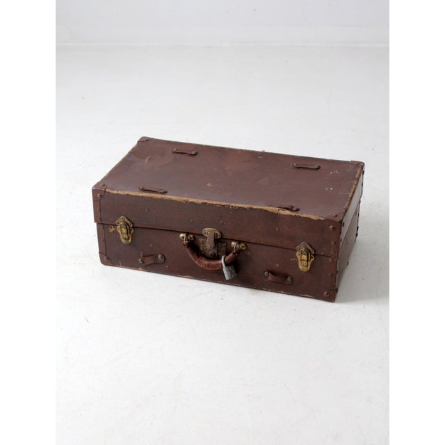 This is an antique P. Becker & Co suitcase from the early 20th century with a 1909 patent date. The "Tanoid" luggage piece...