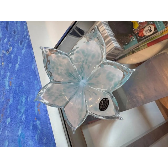 This piece is a masterfully handblown Murano glass sculpture, shaped into a graceful flower with six gently curved petals...