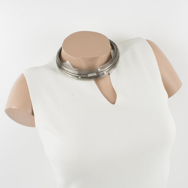 This stunning, rare Thierry Mugler Paris silvered metal multi-strand choker necklace features an around-the-neck shape,...