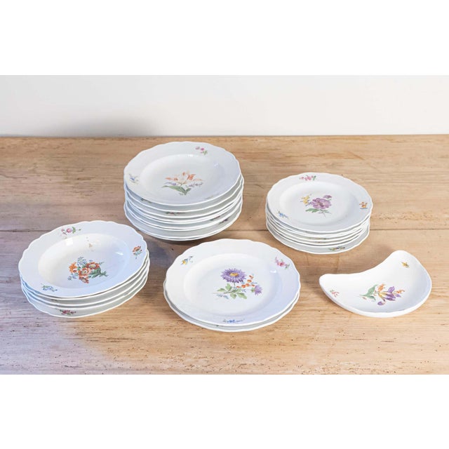 A 24-piece set of German Meissen porcelain service from the 19th century, with floral decor. Born in Eastern Germany...