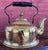 This is a gorgeous vintage solid-brass tea kettle featuring a polished rounded body, decorative curved spout, removable...